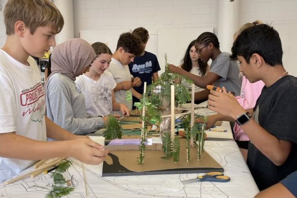 Students gathered together working on their project