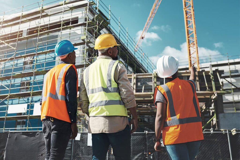 Construction workers observing their work