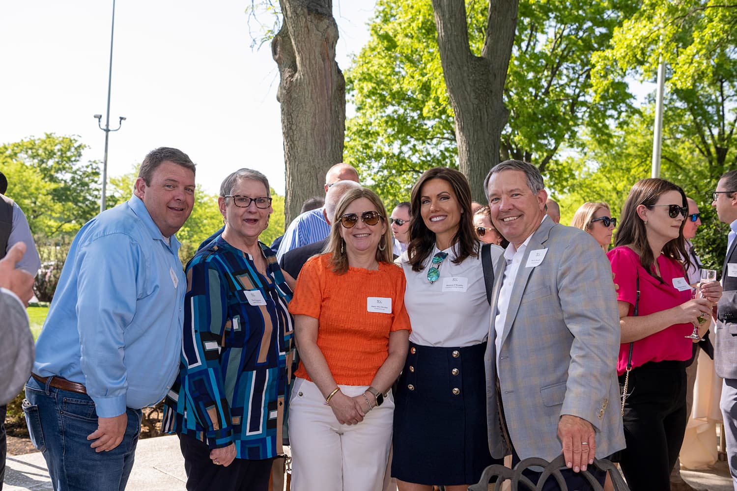 Five people smiling for the camera