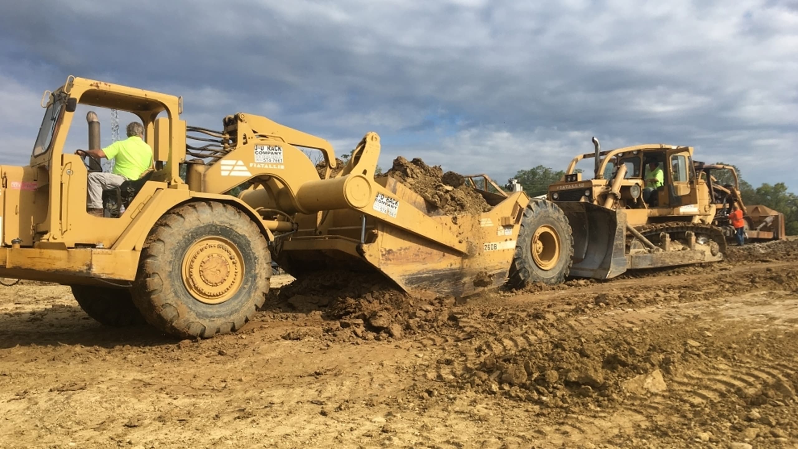 Trucks hard at work in the dirt