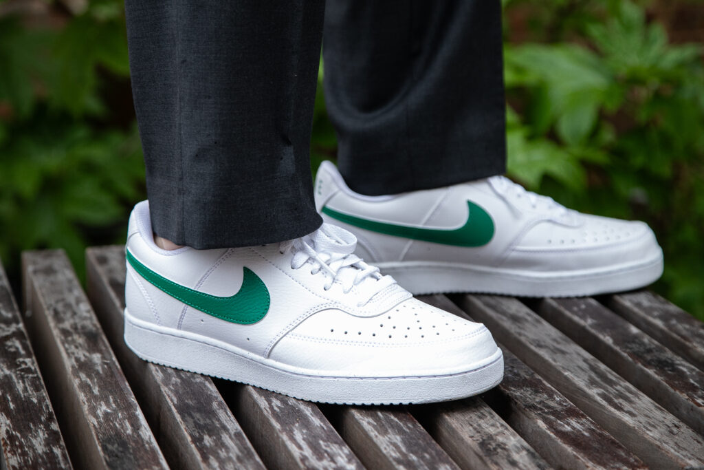 Close up of green and white sneakers