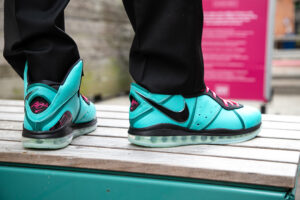 Close up of teal and black sneakers